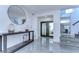 Bright foyer with elegant tile flooring, a decorative console table, and a view of the courtyard at 2113 S West Shore Blvd, Tampa, FL 33629
