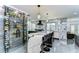 Modern kitchen features marble countertops, wine rack, stainless steel appliances, and a peninsula with barstool seating at 2113 S West Shore Blvd, Tampa, FL 33629