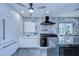 The kitchen features sleek cabinetry, a large island, stainless steel appliances, and modern lighting at 2113 S West Shore Blvd, Tampa, FL 33629
