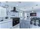 This spacious kitchen features a large island with marble backsplash, stainless steel appliances, and modern lighting at 2113 S West Shore Blvd, Tampa, FL 33629
