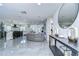 Open-concept living area featuring tile floors, a modern kitchen, a comfortable seating area and stylish design at 2113 S West Shore Blvd, Tampa, FL 33629