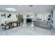 Open-concept living area featuring tile floors, a modern kitchen, a comfortable seating area and stylish design at 2113 S West Shore Blvd, Tampa, FL 33629