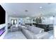 Bright, spacious living area flows into kitchen with bar area with neutral décor and finishes at 2113 S West Shore Blvd, Tampa, FL 33629