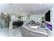 Open-concept living area featuring tile floors, a modern kitchen, a comfortable seating area and stylish design at 2113 S West Shore Blvd, Tampa, FL 33629