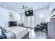 A luxurious bedroom with a TV, massage chair, and access to a balcony at 2113 S West Shore Blvd, Tampa, FL 33629