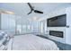 This primary bedroom offers a stone fireplace, abundant natural light, and ample closet space at 2113 S West Shore Blvd, Tampa, FL 33629