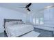 This primary bedroom offers abundant natural light, modern ceiling fan, and ample closet space at 2113 S West Shore Blvd, Tampa, FL 33629