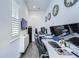 The home office is well-lit with hardwood floors and multiple monitor set up at 2113 S West Shore Blvd, Tampa, FL 33629
