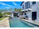 Exterior view showcasing pool, spa, and well manicured outdoor entertaining space at 2113 S West Shore Blvd, Tampa, FL 33629