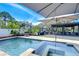 Stunning pool area, beautiful lounge area and landscaping offer a tranquil escape at 2113 S West Shore Blvd, Tampa, FL 33629