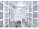 A roomy walk-in closet with abundant storage and a seating area at 2113 S West Shore Blvd, Tampa, FL 33629