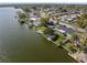 Waterfront home with dock & covered lanai overlooking the canal, with mature trees and easy access to the water at 2146 Society Dr, Holiday, FL 34691