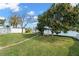 Lush backyard featuring a waterfront and gazebo with dock seating at 2146 Society Dr, Holiday, FL 34691