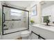 Modern bathroom features a glass-enclosed shower and white vanity with new faucet at 2146 Society Dr, Holiday, FL 34691