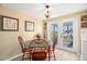 Cozy dining area with a round table, outdoor access, and tranquil views of the canal at 2146 Society Dr, Holiday, FL 34691