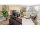Cozy living room with a large screen TV, stylish decor, and a comfortable sectional at 2146 Society Dr, Holiday, FL 34691