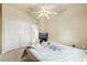 Bedroom with a ceiling fan, and double door closet and ensuite bathroom at 2250 Long View Cir, Brooksville, FL 34604