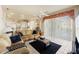 Comfortable living room with cozy seating, a ceiling fan, and access to the outdoor space at 2250 Long View Cir, Brooksville, FL 34604
