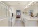 Bright main bathroom with double vanity, garden tub, and walk-in shower at 2250 Long View Cir, Brooksville, FL 34604