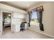 Office space with white built-in cabinets and desk under a large window at 2250 Long View Cir, Brooksville, FL 34604