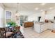 Open concept kitchen and living area with modern appliances, tiled floors, and natural light at 2250 Long View Cir, Brooksville, FL 34604
