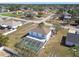 Aerial view of home featuring a screened pool and a white fence surrounding the backyard at 2403 Hawthorne Rd, Spring Hill, FL 34609