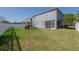 Spacious backyard with lush lawn and a play structure; great for outdoor fun at 3025 Chessington Dr, Land O Lakes, FL 34638