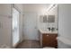Bathroom features a vanity with sink, medicine cabinet and a toilet to the side at 3025 Chessington Dr, Land O Lakes, FL 34638