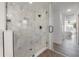Bathroom boasting a sleek glass-enclosed shower, modern fixtures, and stylish tile accents at 3025 Chessington Dr, Land O Lakes, FL 34638