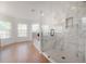 Primary bath featuring a glass shower and soaking tub at 3025 Chessington Dr, Land O Lakes, FL 34638