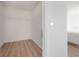 Walk-in closet with wood floor and wire shelving at 3025 Chessington Dr, Land O Lakes, FL 34638