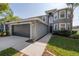 Charming two-story home featuring a well-maintained lawn, attached two-car garage, and a welcoming entryway at 3025 Chessington Dr, Land O Lakes, FL 34638