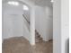 Bright foyer featuring an open staircase and natural light at 3025 Chessington Dr, Land O Lakes, FL 34638