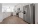 Well-lit kitchen featuring stainless steel appliances, white cabinets, and tiled floor, creating a functional and stylish space at 3025 Chessington Dr, Land O Lakes, FL 34638