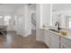 Bright, modern kitchen featuring stainless steel appliances and a breakfast bar at 3025 Chessington Dr, Land O Lakes, FL 34638