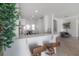 Open-concept living space featuring a breakfast bar connecting to the updated kitchen and dining area at 3025 Chessington Dr, Land O Lakes, FL 34638