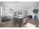 Open-concept living and dining area with neutral decor and plenty of light at 3025 Chessington Dr, Land O Lakes, FL 34638
