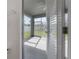 Screened-in porch showcases white trim, a concrete floor, and a view of the fenced backyard at 3025 Chessington Dr, Land O Lakes, FL 34638