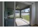 Screened-in porch with a ceiling fan and view of a fenced-in backyard at 3025 Chessington Dr, Land O Lakes, FL 34638