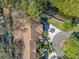 Birds eye view of a townhouse with a two-car garage and a meticulously landscaped circular driveway at 3042 Branch Dr, Clearwater, FL 33760