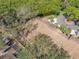 An aerial view of the home's roof and surrounding lush greenery, showcasing its peaceful setting at 3042 Branch Dr, Clearwater, FL 33760