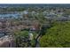 Lovely aerial view of townhouse with a large lake on one side and a creek to the right at 3042 Branch Dr, Clearwater, FL 33760
