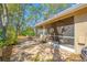 A screened-in patio features a ceiling fan and comfortable seating, offering a relaxing outdoor space at 3042 Branch Dr, Clearwater, FL 33760