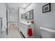 Bathroom with white vanity, framed mirror, and views to upstairs hallway and loft at 3042 Branch Dr, Clearwater, FL 33760