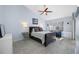 Light-filled bedroom featuring light blue walls, neutral decor, and a ceiling fan at 3042 Branch Dr, Clearwater, FL 33760