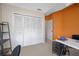Bedroom featuring a large closet with sliding doors and an accent wall at 3042 Branch Dr, Clearwater, FL 33760