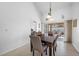 Bright dining room featuring tile flooring, modern decor, and sliding glass doors to an outdoor space at 3042 Branch Dr, Clearwater, FL 33760