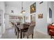 Bright dining room with neutral tones, chandelier, and sliding glass doors to an outdoor space at 3042 Branch Dr, Clearwater, FL 33760