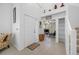 A bright entryway featuring neutral walls and tile flooring with a view into the living room at 3042 Branch Dr, Clearwater, FL 33760