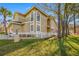 Charming exterior view of the home with a white picket fence and lush green lawn at 3042 Branch Dr, Clearwater, FL 33760